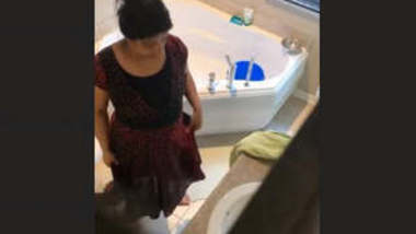 Have a look to my cute sister in bathroom. Hidden cam